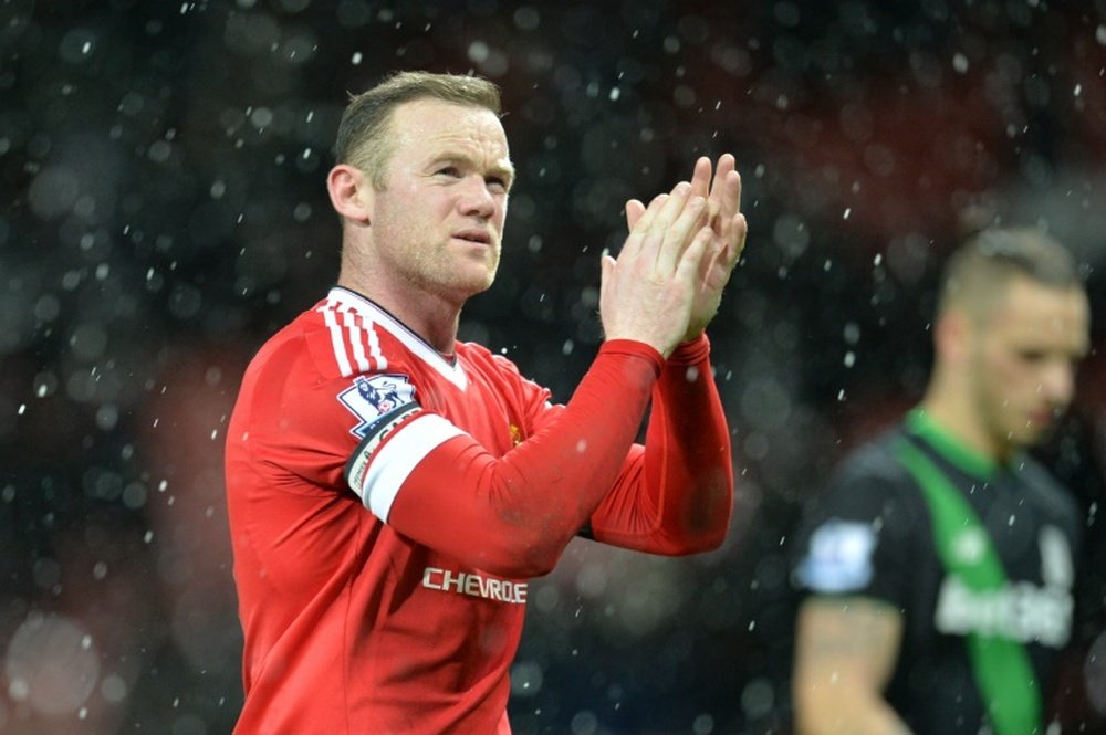 Manchester Uniteds English striker Wayne Rooney applauds at the end of the English Premier League football match between Manchester United and Stoke City at Old Trafford in Manchester, north west England, on February 2, 2016