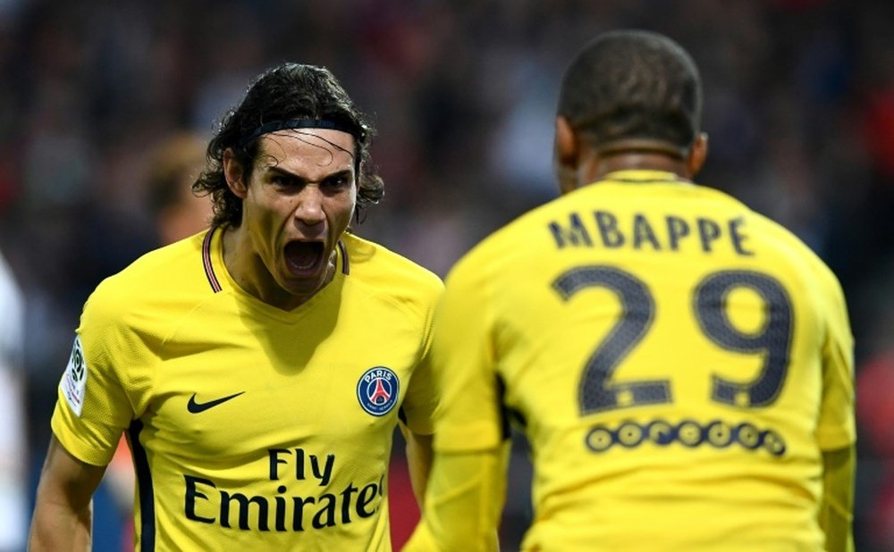 Cavani scored twice to bring up his Ligue 1 century. AFP