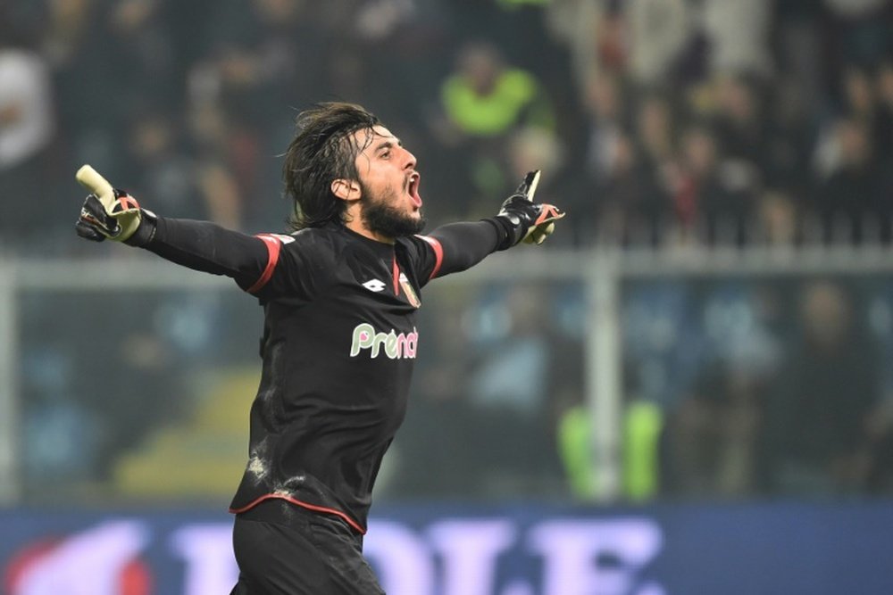 Genoa goalkeeper Mattia Perin celebrates Leonardo Pavoletti's goal against AC Milan. AFP