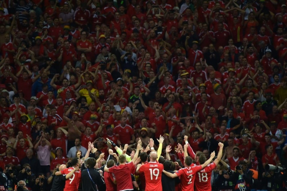 Wales players celebrate at the end of the Euro 2016 quarter-final match.AFP