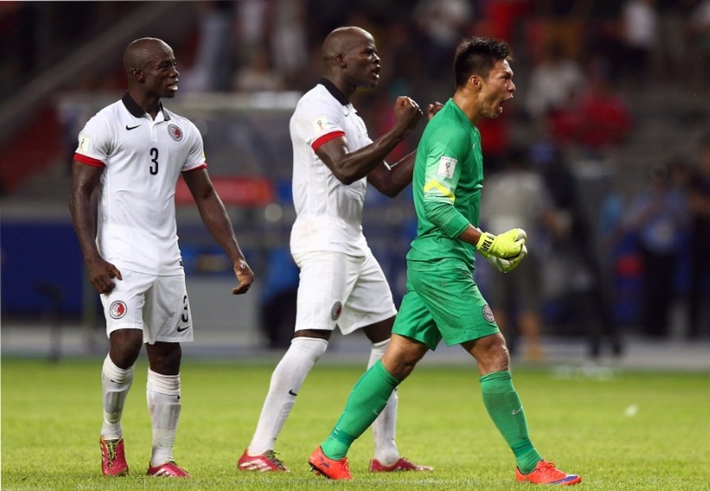 Hong Kongs goalkeeper Yapp Hung Fai (R) and teammates celebrate after a friendly match against China, in Shenzhen, in September 2015