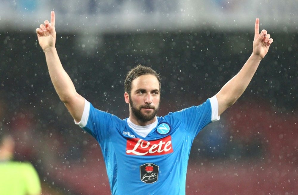 Napolis forward Gonzalo Higuain celebrates after scoring during the Italian Serie A football match between SSC Napoli and Atalanta BC in Naples on May 2, 2016