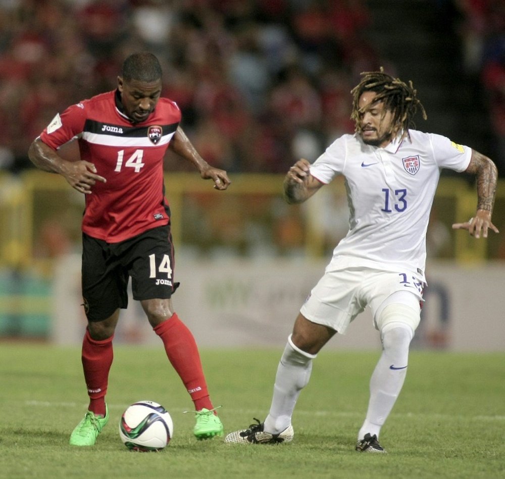 US Jermaine Jones (R) challenges Trinidad & Tobagos Andre Boucaud during the FIFA WC Russia 2018 CONCACAF football qualifier in Port of Spain, on November 17, 2015
