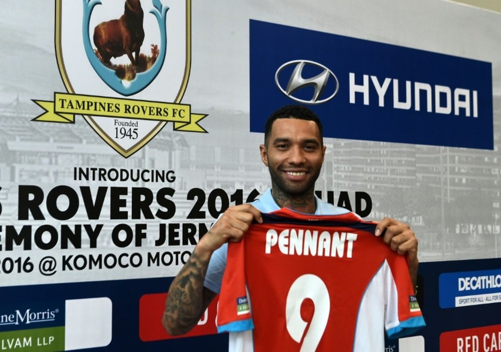 Former Arsenal and Liverpool winger Jermaine Pennant poses with his jersey after signing ceremony with the Tampines Rovers, in Singapore, on January 19, 2016
