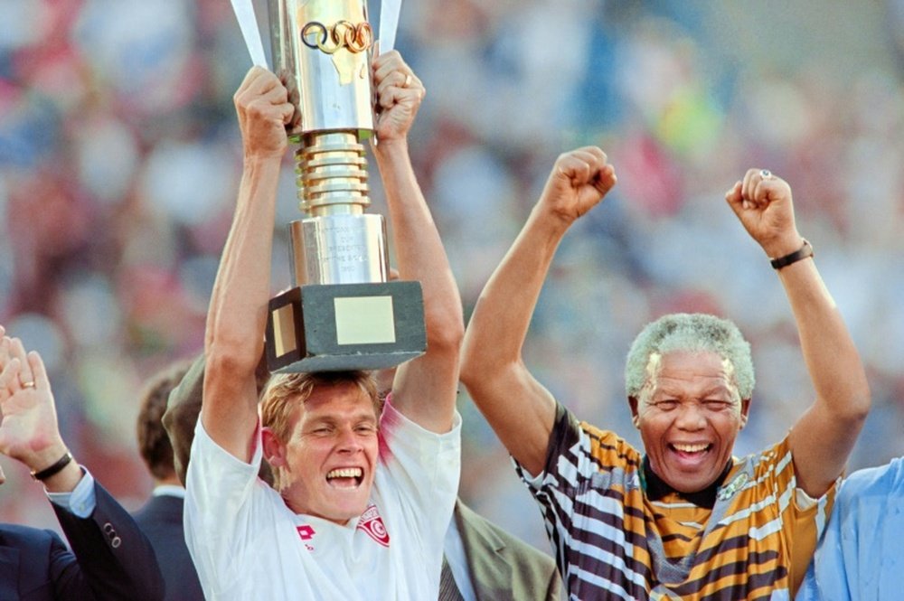 Neil Tovey celebrates with Nelson Mandela in 1996 after South Africa won the Africa Nations Cup