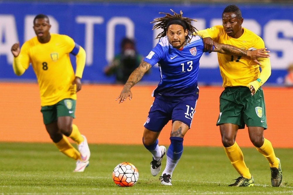Jermaine Jones of the United States fends off Seinard Bowens of St. Vincent and the Grenadines during a World Cup qualifying match at Busch Stadium on November 13, 2014 in St. Louis, Missouri