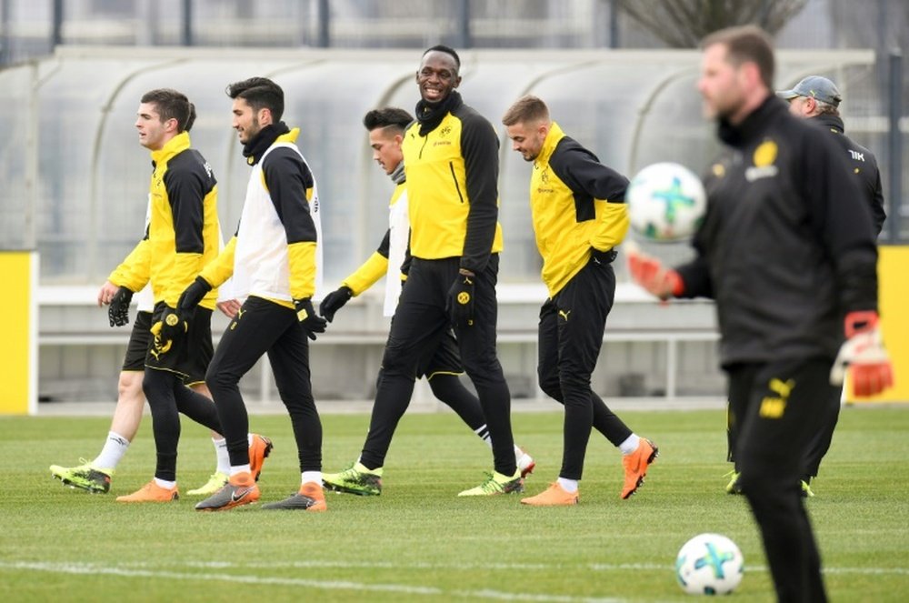 Bolt trained with Dortmund. AFP