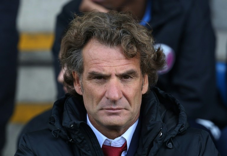 Qatar coach plays down growing World Cup hopes