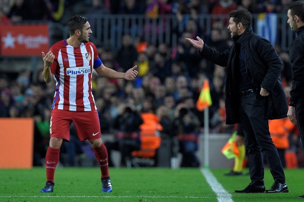 Atletico Madrid coach Diego Simeone giving instructions to Koke during Tuesday's match. AFP