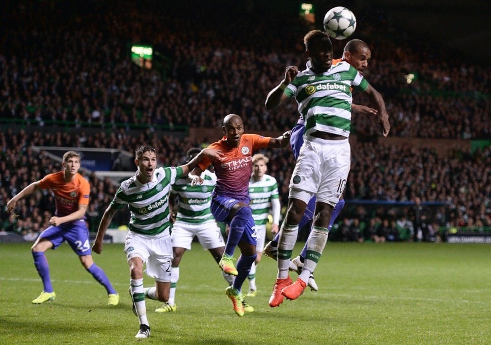 Manchester Citys Brazilian midfielder Fernando (R) vies in the air with Celtics French striker Moussa Dembele during the UEFA Champions League match in Glasgow, Scotland on September 28, 2016
