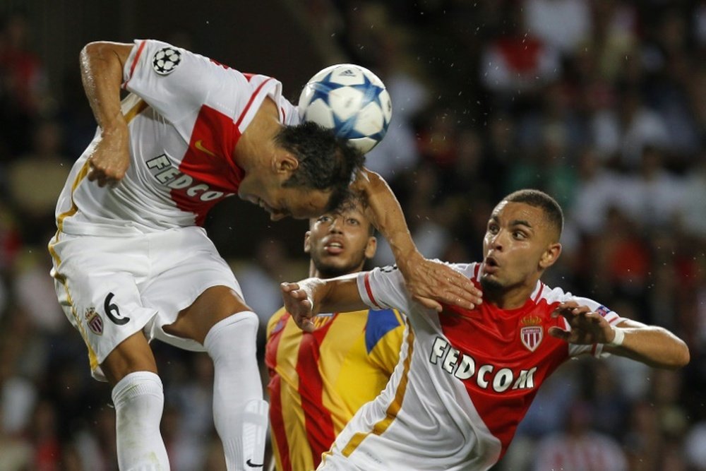 Monacos Portuguese defender Ricardo Carvalho heads the ball during the UEFA Champions League playoff football match between AS Monaco FC vs Valencia CF, at the Louis II Stadium, in Monaco, on August 25, 2015