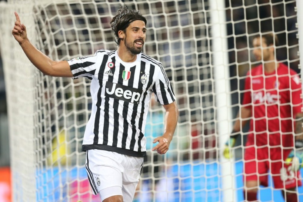 Juventus midfielder Sami Khedira (left) from Germany celebrates after scoring during the Italian Serie A football match Juventus against Bologna at the Juventus Stadium in Turin on October 4, 2015