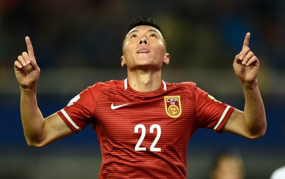 Chinas Yu Dabao celebrates a goal against Bhutan during their 2018 FIFA World Cup qualifying match in Changsha on November 12, 2015