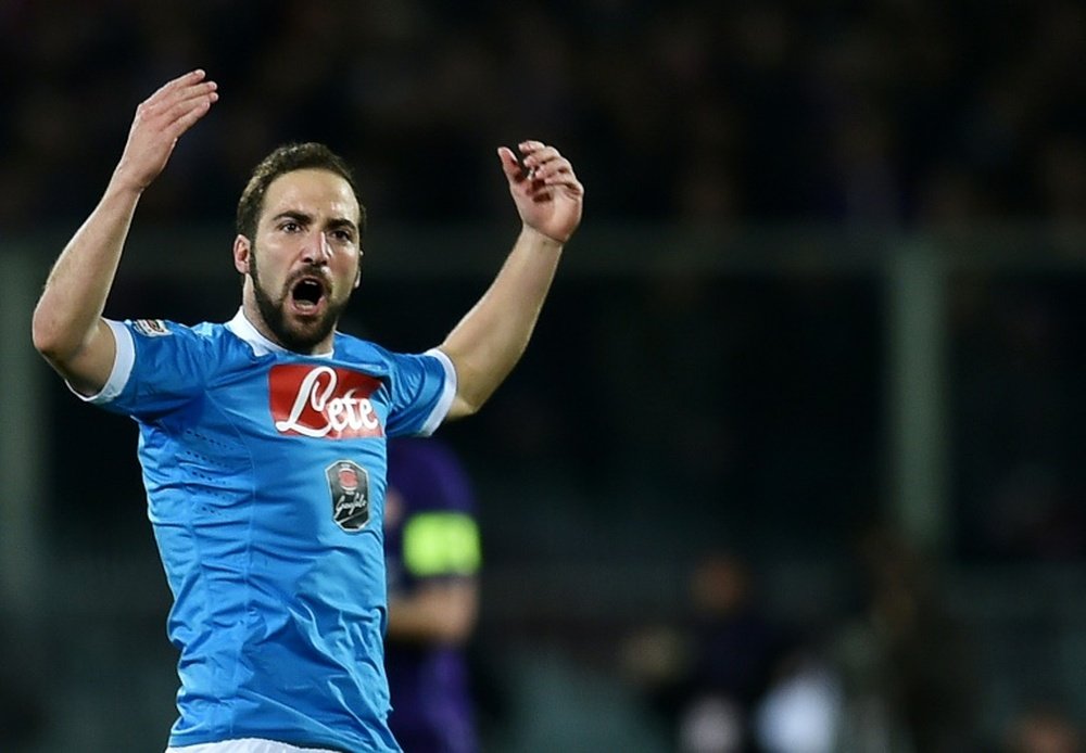 Napoli's forward Gonzalo Higuain celebrates after scoring a goal during an Italian Serie A football match against Fiorentina on February 29, 2016, at the Artemio Franchi stadium in Florence