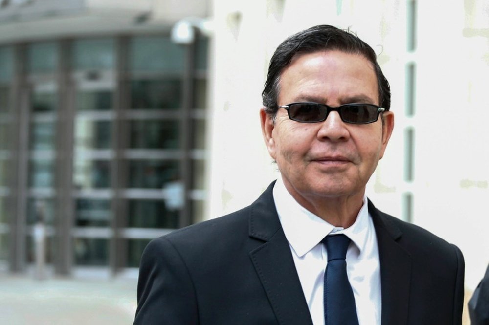 Former Honduran president Rafael Callejas leaves the Brooklyn federal court in New York, March 28, 2016 after pleading guilty to charges of racketeering conspiracy and wire fraud conspiracy in connection with the FIFA corruption scandal