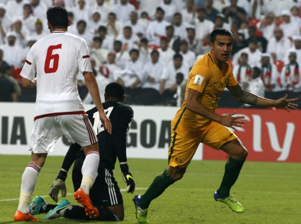 Australias Tim Cahill (R) celebrates after scoring a goal against the United Arab Emirates on September 6, 2016