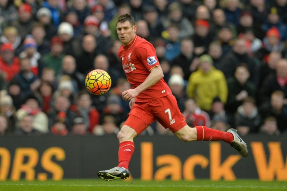 Liverpools midfielder James Milner picks up the ball to shoot high over the bar during the English Premier League football match between Liverpool and Manchester United at Anfield in Liverpool, England, on January 17, 2016