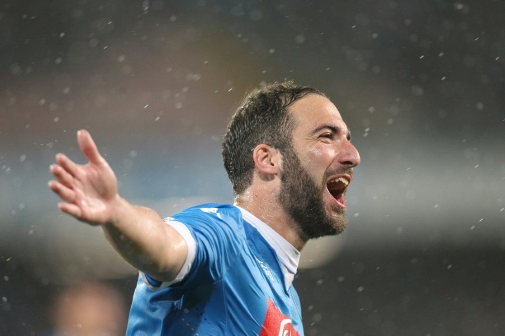 Napolis forward Gonzalo Higuain celebrates after scoring his 36th goal in the season during the Italian Serie A football match SSC Napoli vs Frosinone Calcio on May 14, 2016 at the San Paolo stadium in Naples