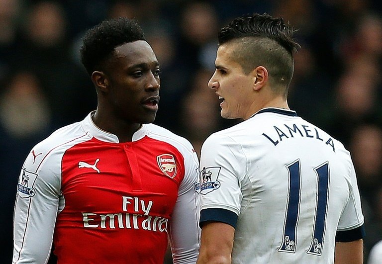 Tottenham Hotspurs Lamela and Arsenals Welbeck pictured during a Premier League match. AFP