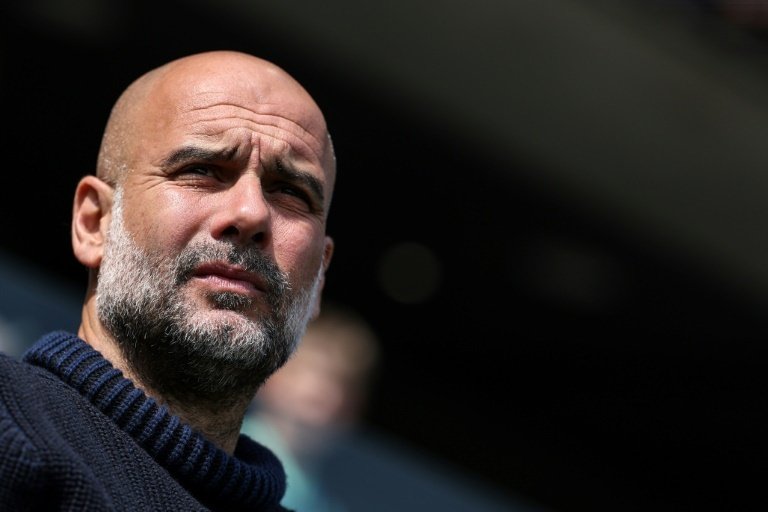 Guardiola shrugs off Man City defeats, hails Barca academy