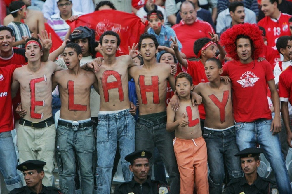 Egyptian fans celebrate before the match between Al-Ahli and Al-Zamalek football clubs in Cairo in May 2006, prior to the crowd ban