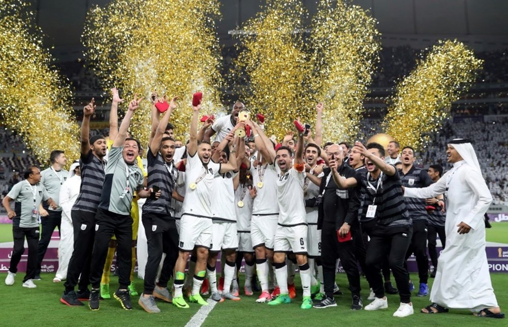 Al-Sadds players celebrate their victory in the Qatar Emir Cup