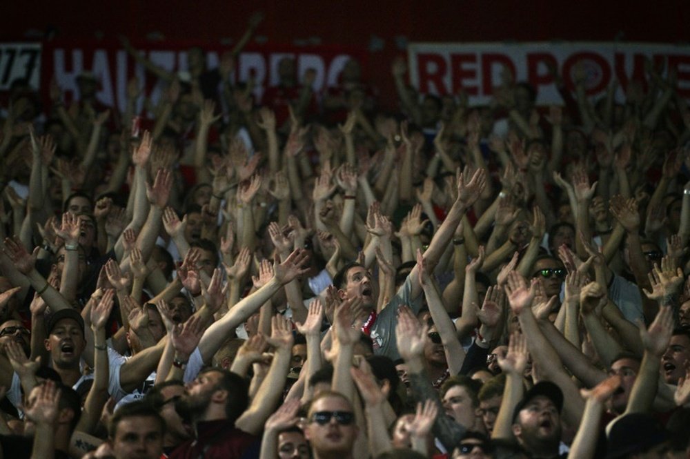 Bayern Munichs supporters cheer before a Group F Champions League football game at the Karaiskaki stadium against Olympiakos in Athens on September 16, 2015