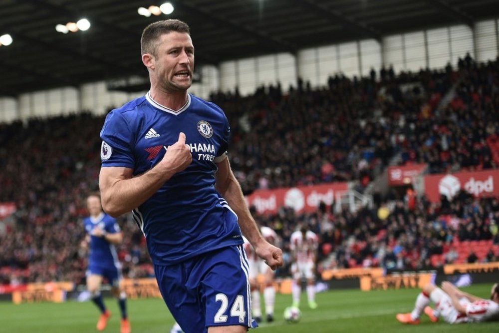 Mike Pejic says that Gary Cahill doesn't deserve his Premier League winners medal. AFP