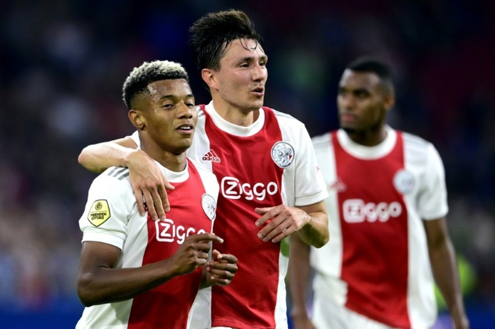 Easy does it: Ajax's David Neres and Steven Berghuis celebrate their fourth goal. AFP