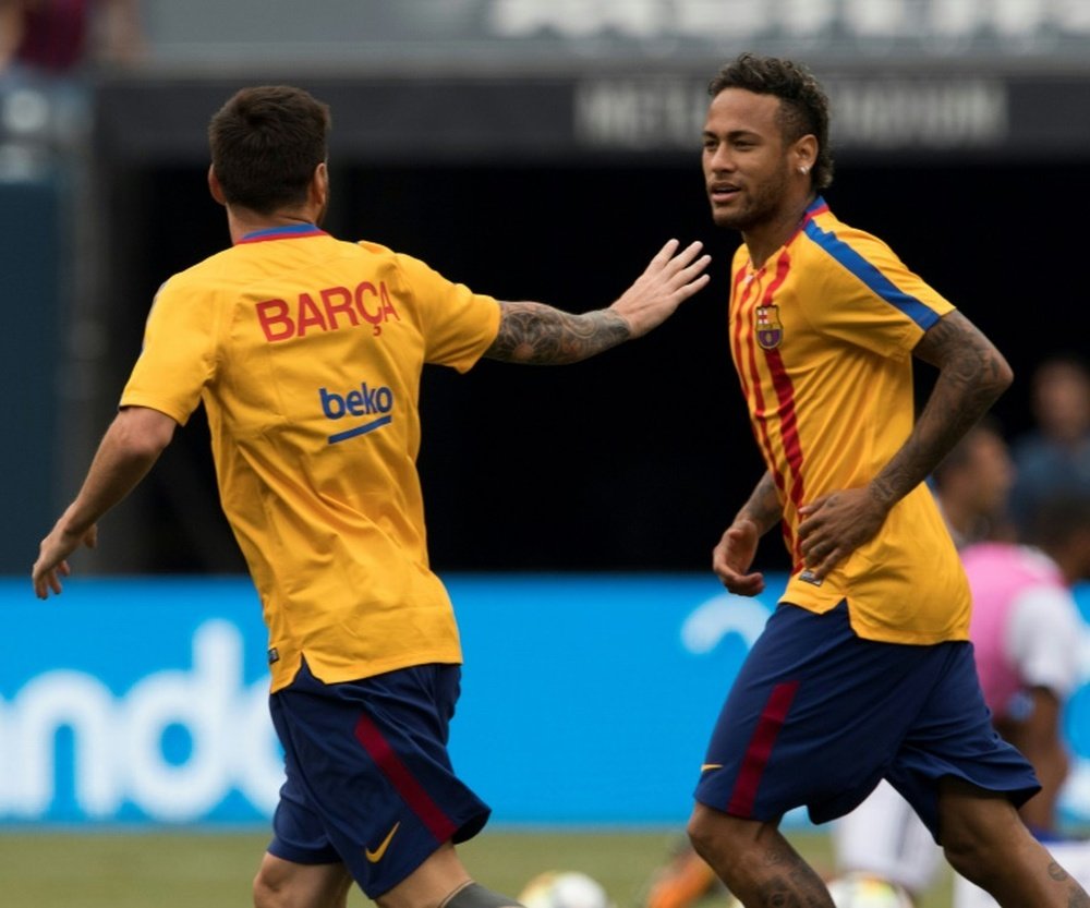 Lionel Messi is among those to have asked Neymar to stay at Barcelona. AFP