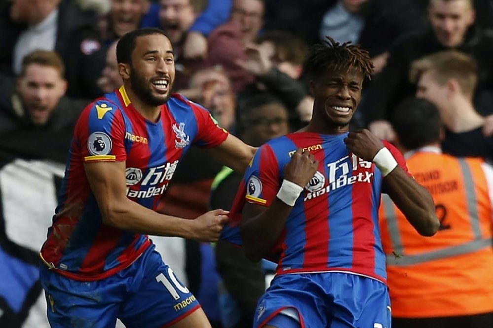 Townsend and Zaha celebrate scoring against West Ham United. AFP