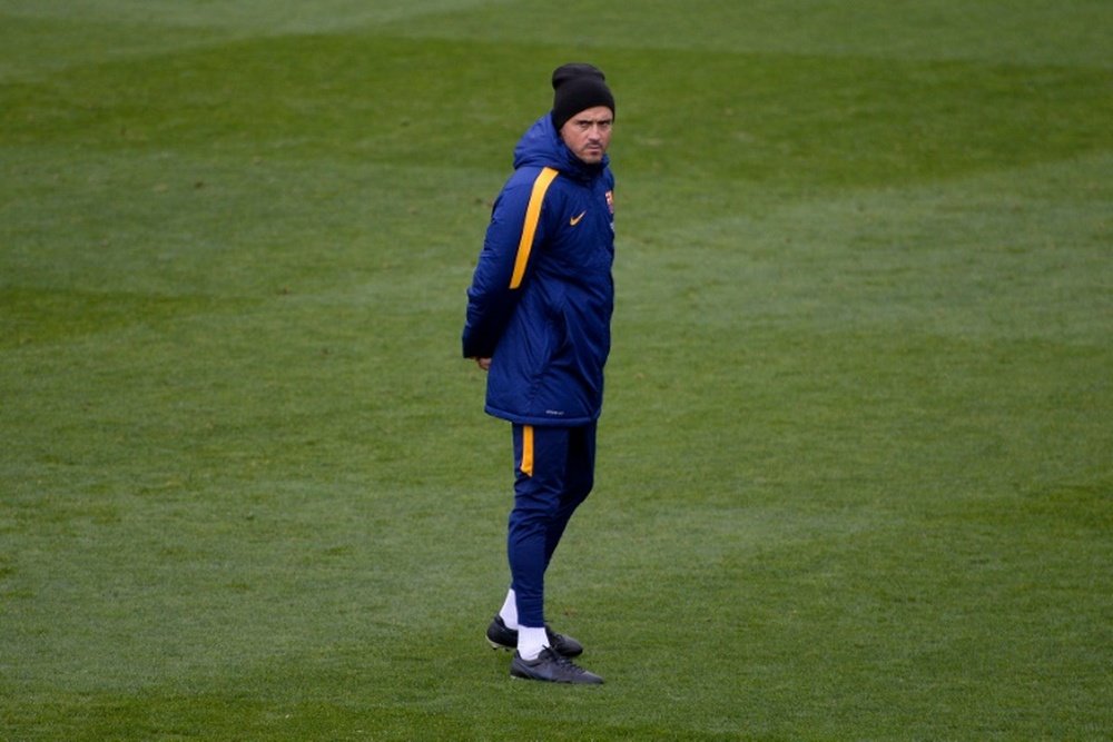 Barcelonas coach Luis Enrique stands on the pitch during an open training session at the Mini Stadium in Barcelona on January 4, 2016