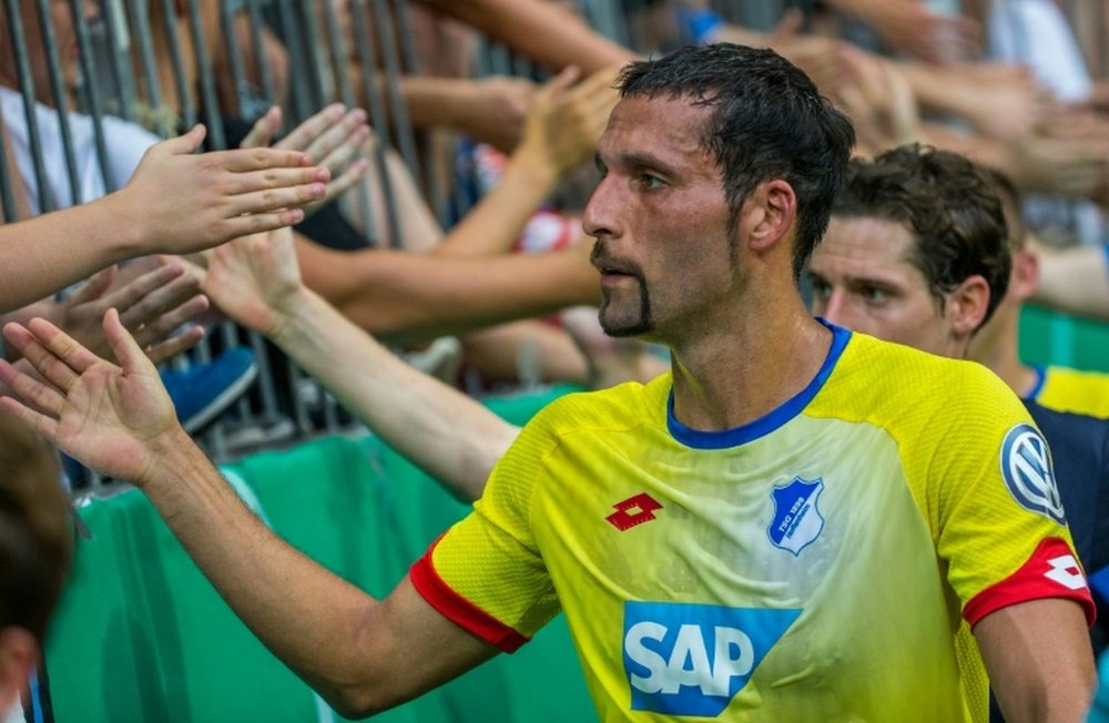Hoffenheims Kevin Kuranyi greets fans following their German Cup DFB Pokal first round match against TSV 1860 Muenchen, in Munich, southern Germany, on August 8, 2015