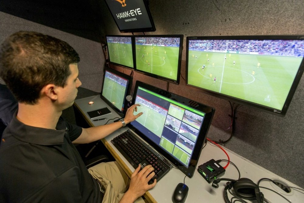 A referee looks at the broadcast of a Netherlands Cup football match on September 21. AFP