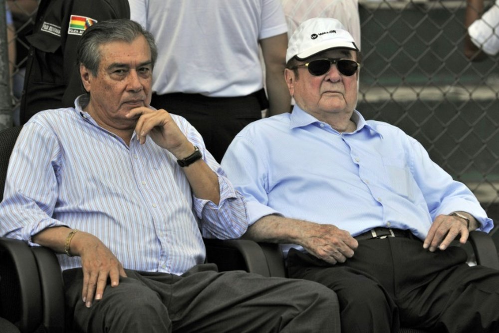 Former Conmebols president Nicolas Leoz (R) and Conmebols treasurer Romer Osuna, during a friendly football match between Bolivia and Brazil in Santa Cruz, Bolivia on April 6, 2013