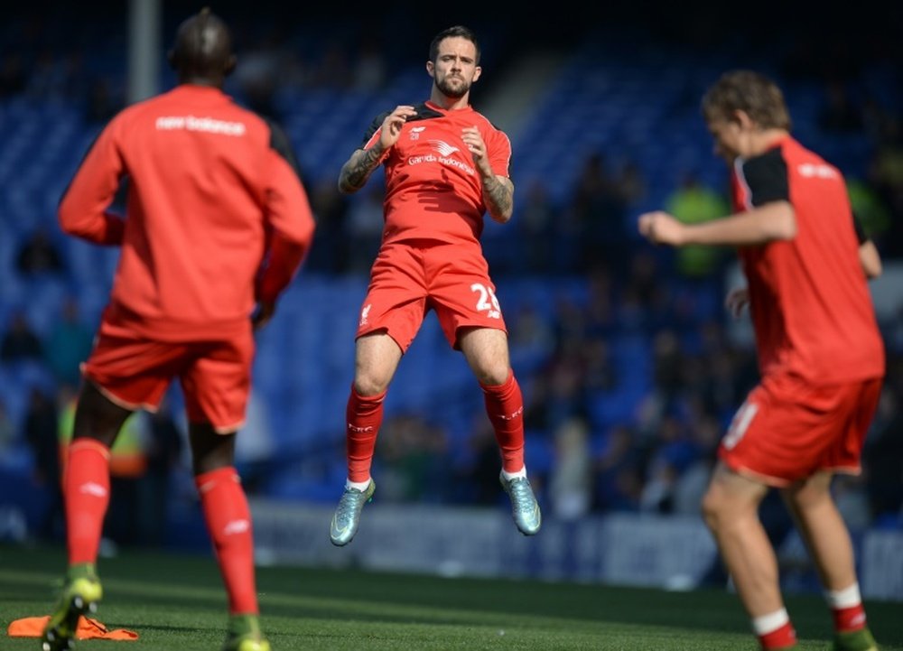 Danny Ings (centre) put Liverpool ahead when he capitalised on some lacklustre Everton defending and headed in from James Milners cross