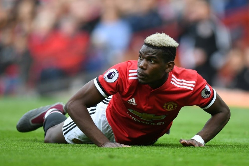 Pogba has suffered a mixed season at United. AFP