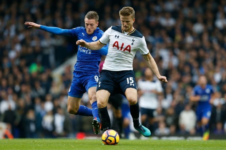 Dier (R) is challenged by Leicester's Jamie Vardy. AFP