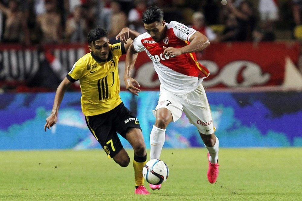 Lilles midfielder Sofiane Boufal (L) fights for the ball with Monacos midfielder Nabil Dirar during a French L1 football match on August 14, 2015, at the Louis II Stadium in Monaco