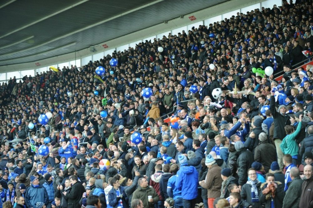 Ipswich Town fans sing in the crowd before kick off of a football match at St Marys Stadium in Southampton, southern England, on January 4, 2015