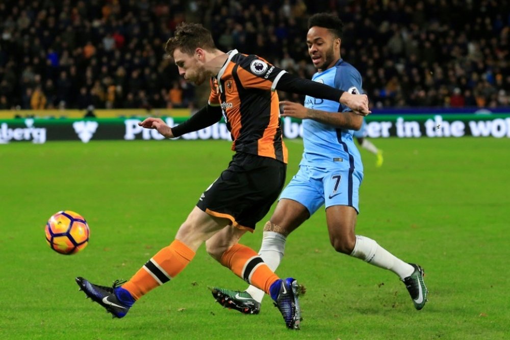 Hull City defender Andrew Robertson (L) vies with Manchester City midfielder Raheem Sterling during the English Premier League football match between Hull City and Manchester City at the KCOM Stadium on December 26, 2016