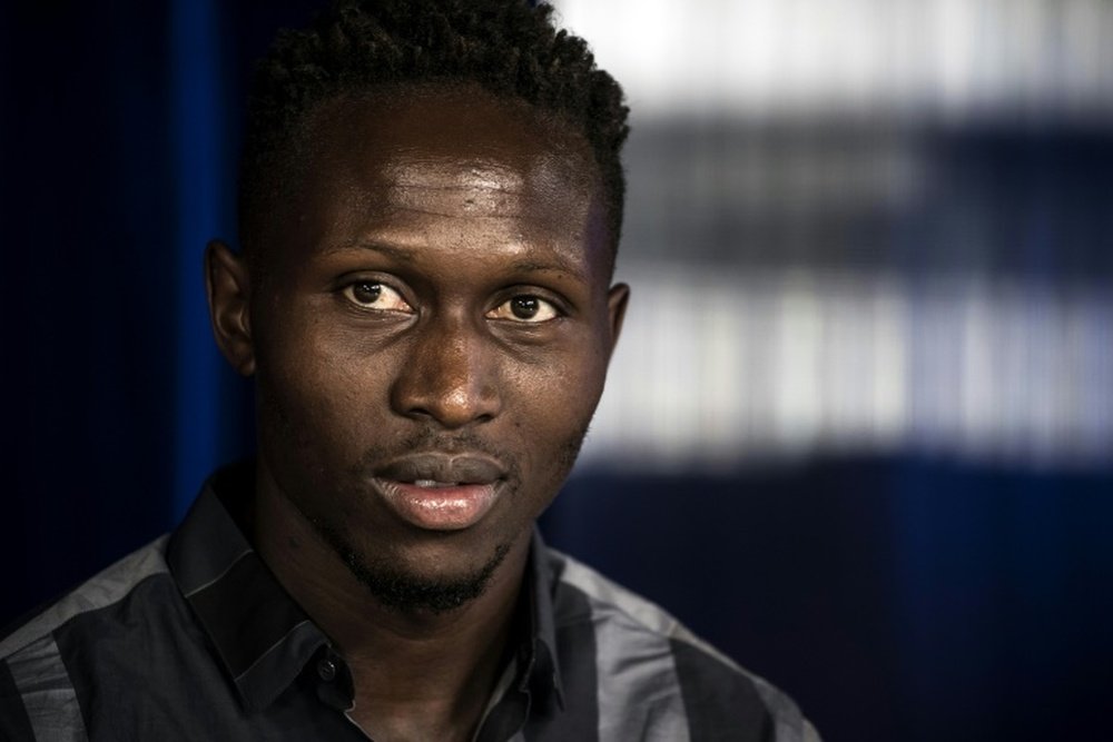 Lyons new defender Mapou Yanga Mbiwa looks on during a press conference on August 17, 2015