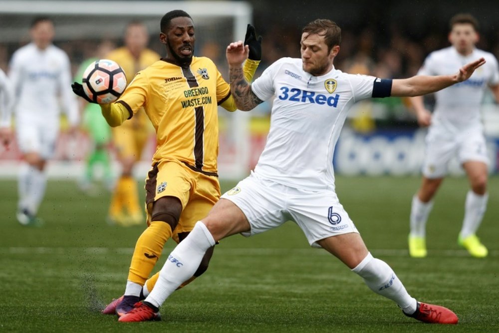 Leeds captain Cooper insists they won't blow promotion hopes this year. AFP