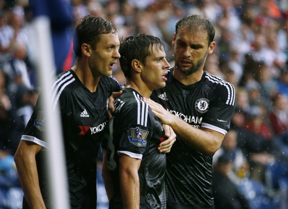 Chelseas Cesar Azpilicueta (C) celebrates with teammates Nemanja Matic and Branislav Ivanovic (R) after scoring a goal during an English Premier League match in West Bromwich, on August 23, 2015