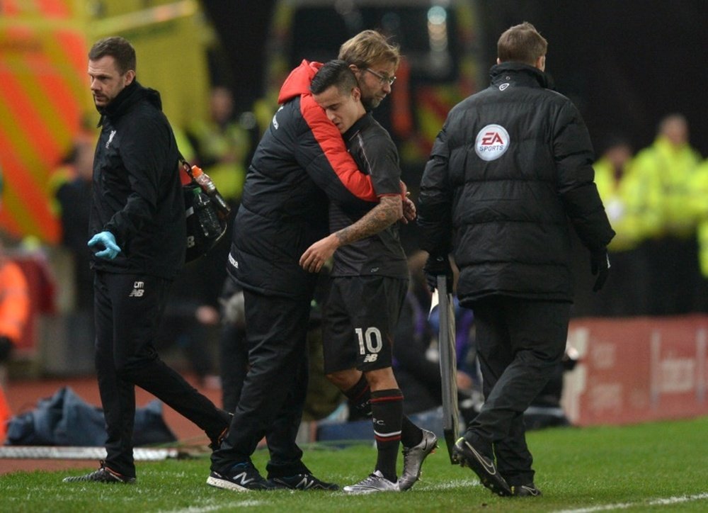 Coutinho et Jurgen Klopp lors du match de Liverpool. AFP