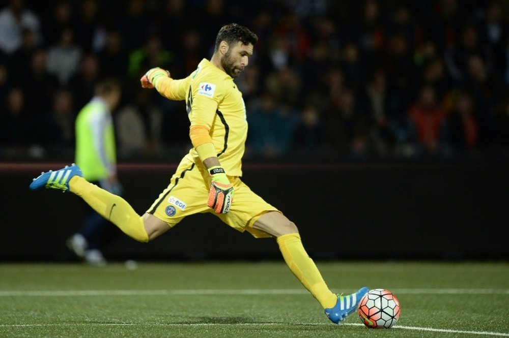 Paris Saint-Germains goalkeeper Salvatore Sirigu kicks the ball back into play during the match against Lorient in Lorient, western France, on April 19, 2016