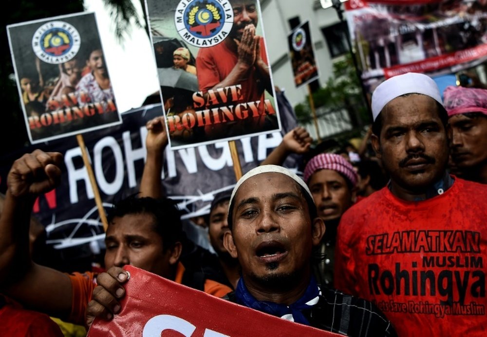Rohingya Muslim refugees protest against the persecution of Rohingya Muslims in Myanmar, outside the Myanmar Embassy in Kuala Lumpur on November 25, 2016
