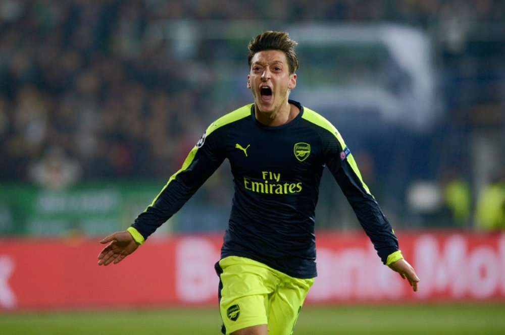 Arsenal's midfielder Ozil celebrates after scoring a goal against PFC Ludogorets. AFP
