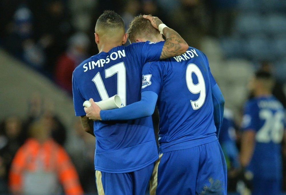 Leicester Citys English defender Danny Simpson (L) and striker Jamie Vardy embrace after their team beat Stoke City 3-0 in the English Premier League match on January 23, 2016