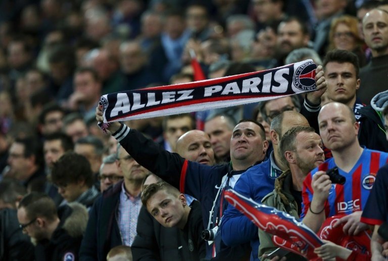 A Paris Saint-Germain fan is pictured before the French L1 football match between Caen and Paris Saint-Germain, on December 19, 2015 in Caen, France